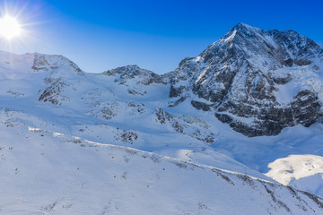 Fototapeta na wymiar Snowy Italian Alps Sulden, Solda with Ortler, Zebru, Grand Zebru in background. Val Venosta, South Tirol, Italy. 