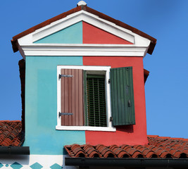 house with a terrace with painted wall in two different colors