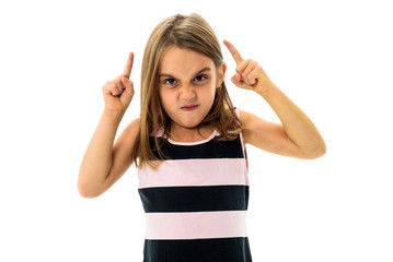 Little young girl is angry, mad, disobedient with bad behaviour.