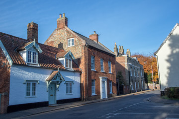 Fototapeta na wymiar Old town houses in typical English village street. Wymondham UK.