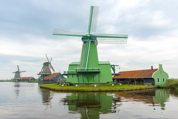 Fototapeta na wymiar Windmills in Zaanse Schans. The Zaanse Schans is a typically Dutch small village in Amsterdam, Netherlands..