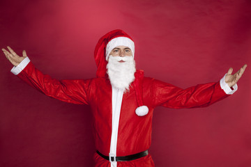Fototapeta na wymiar Santa Claus spread his arms with joy