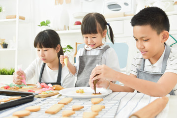 Kids decorating cookies.