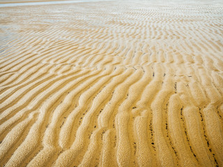 Natural Pattern Made By Sea Waves In The Sand. Abstract background