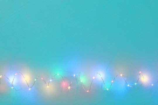Christmas wire light on turquoise canvas