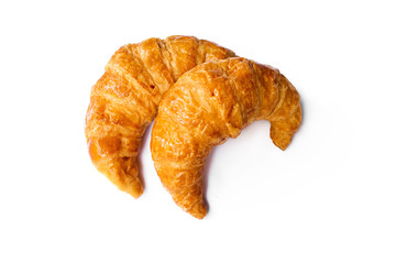 freshly baked croissants on white background, top view