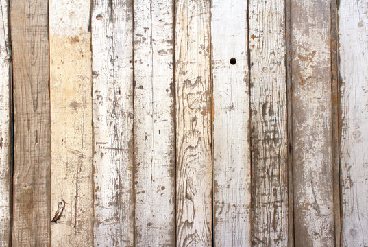 Ancient wood with cracked paint of white color
