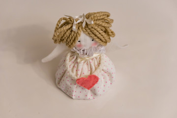 Hand-made decoration for the Christmas night. Preparing to make an angel, the wings are not hooked. Concept coziness.