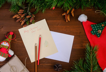 paper letter to Santa Claus on a wooden table