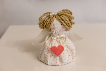 Hand-made decoration for the Christmas night. Preparing to make an angel, the wings are not hooked. Concept coziness.