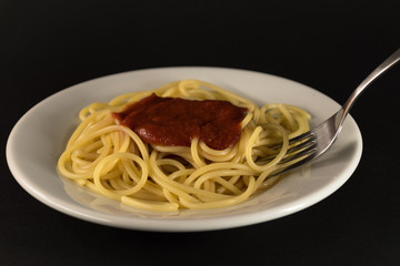 Fototapeta premium Italian spaghetti with tomato sauce with fork 
