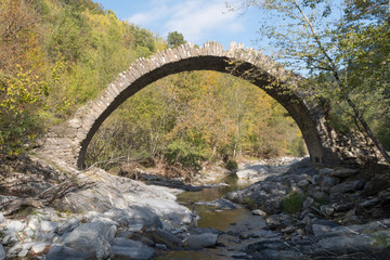 The arch bridge in mountains, Alps, Italy