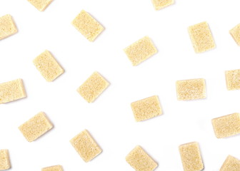 Brown cane sugar cubes isolated on white background, top view
