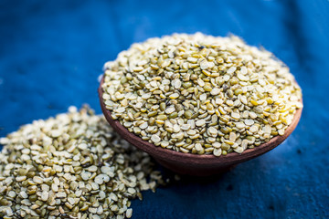 Vigna radiata,mung dal,Split Green gram in a clay bowl.