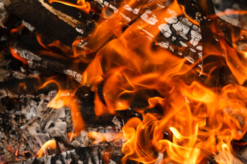 Flame fire background burning and glowing charcoal