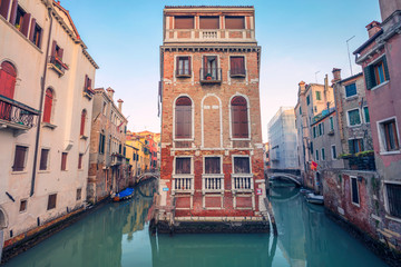 Fototapeta na wymiar Venice. Cityscape image of narrow canals in Venice during sunset.