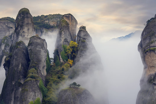 Fototapeta Fog above mysterious cliffs, foggy autumn landscape