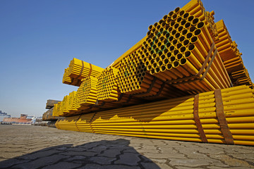Yellow stacked steel pipe