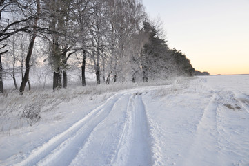 Fototapeta na wymiar Beautiful winter road view. Winter road wallpaper. Snow Track Road.