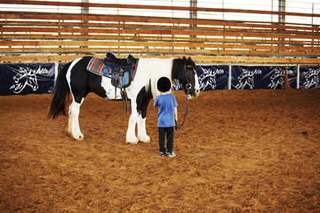 Ber Yakov, Israel - September 28, 2016: Horse riding lessons for kids