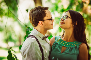 Beautiful young couple on the park background