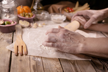 Mother and daughter make home-made pizza. Home-made pastries and cooking. Traditional Mediterranean cuisine