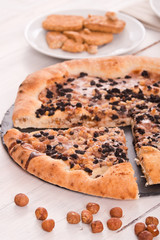 Sweet chocolate pizza with cookies. 