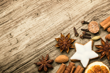 Christmas spices  -  Flat lay, background with cinnamon, anise, cookie and other