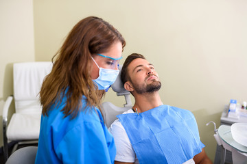 A patient getting attended and treatment in a dental studio