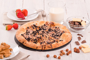 Sweet chocolate pizza with cookies. 
