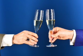 Corporate Christmas party concept. Businessmen raising toast with champagne