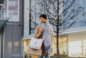 Woman walking with shopping bags