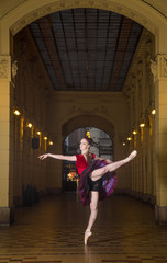 Obraz premium Ballerina Natalia Horsnell doing an arabesque in the Oktogon public urban passageway in Zagreb, Croatia.