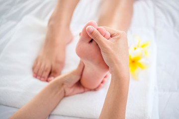 Obraz na płótnie Canvas Foot massage in spa salon