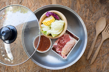 Sliced pork and vegetables in hot pot