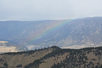 Fototapeta na wymiar Rainbow over the valley