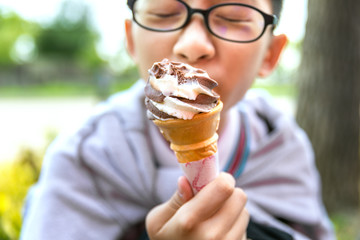 Ice cream cone in child hand