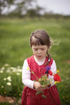 Girl with bunch of flowers, Santanyi, Majorca, Balearic Islands, Spain