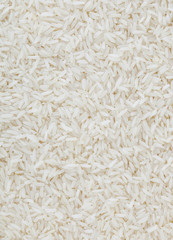 Uncooked white long-grain rice background