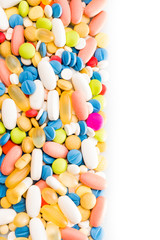 pills border over white. colorful pills isolated on white