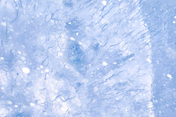 Texture of ice in winter. Pieces of frozen water on a street in 