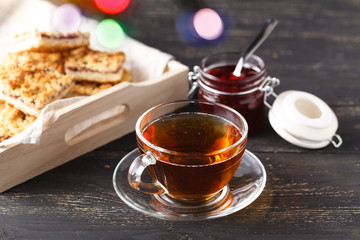 Close-up of home-made biscuits and a cup of tea on the table