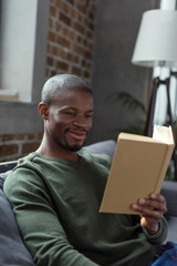 african american man reading book
