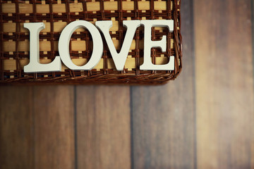 word Love from wooden letters on background