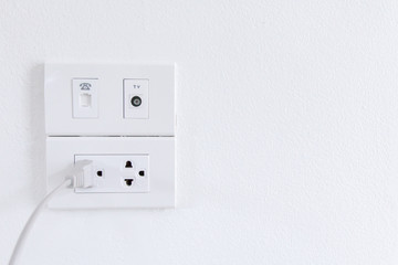 White electric plugs on wall background,White outlet interior, interior electric outlet in home,Socket electricity interior