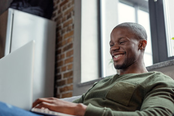 african american man with laptop