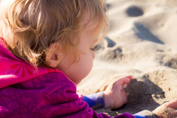 kid loving the beach