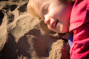 kid loving the beach