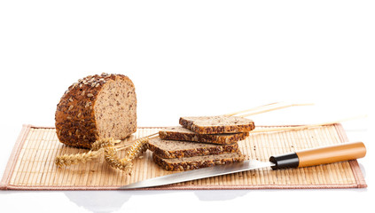 Sliced  bread on cutting board. knife and bread