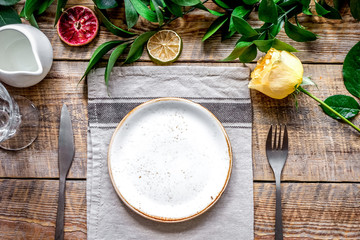 ceramic tableware top view on wooden background mock up